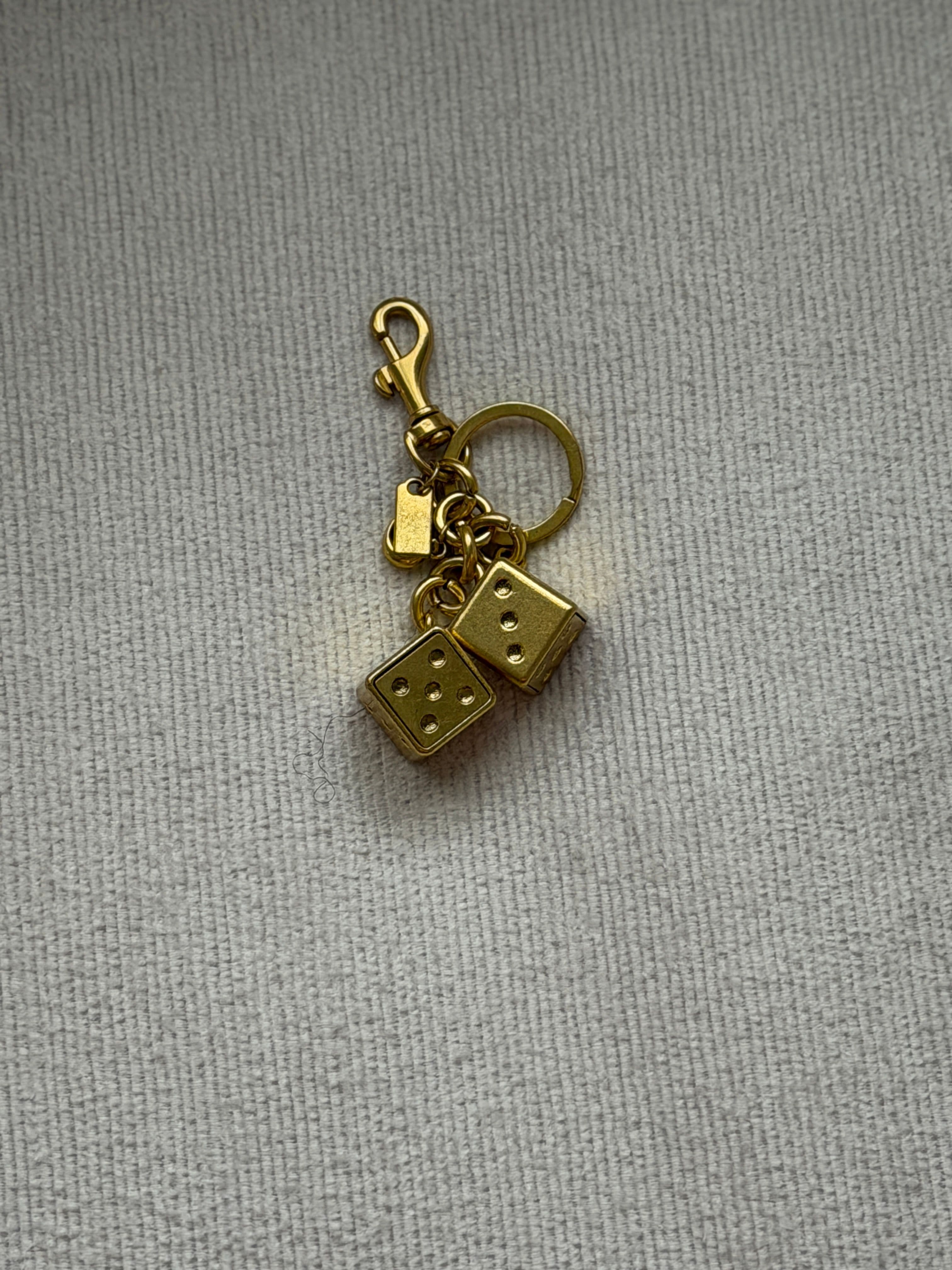 Sartorial dice charm